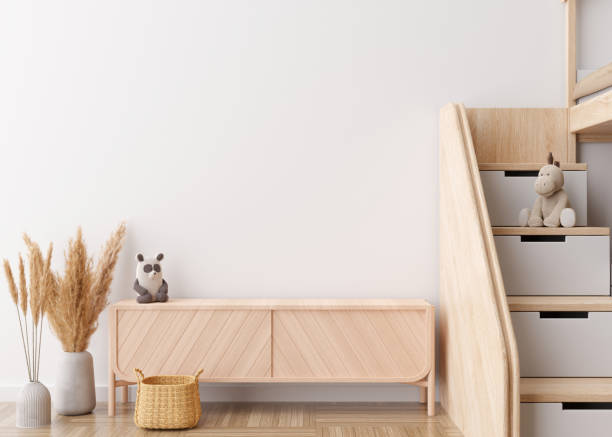 istock Empty white wall in modern child room. Mock up interior in scandinavian style. Copy space for your artwork, picture or poster. Bed, sideboard, pampas grass in vase. Cozy room for kids. 3D rendering. 1439011365