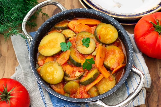 istock Vegetarian zucchini stew with carrots and tomatoes 1439011920