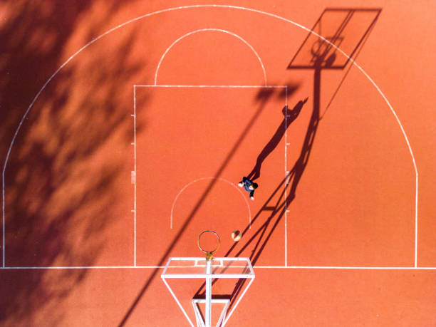 istock One boy playing basketball outdoors 1439013865