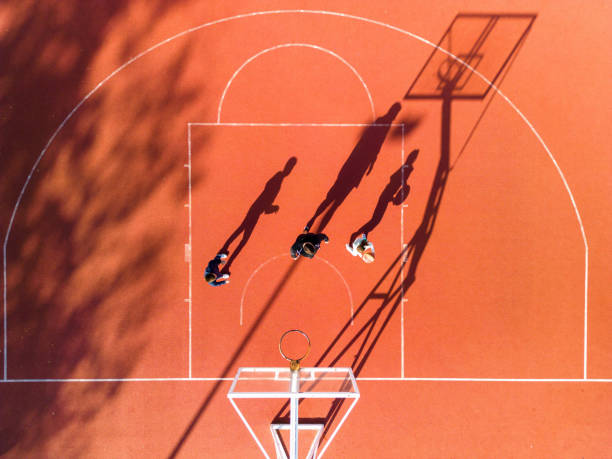 istock Father playing basketball with his children 1439013867
