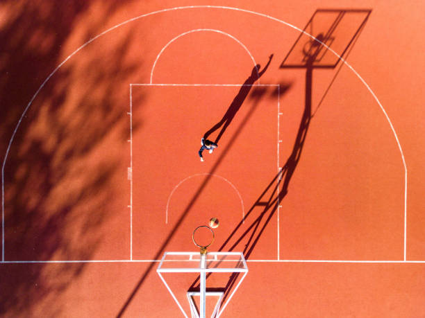 istock One boy playing basketball outdoors 1439013881