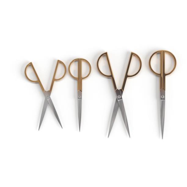 istock Closeup shot of four scissors on the white background 1439016671