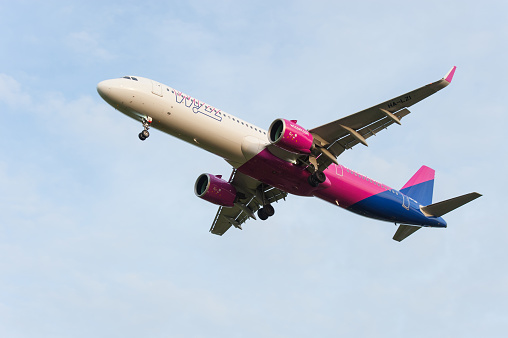 An Airbus A321 from the low-cost carrier WizzAir about to land on runway 21 at Eindhoven Airport. Eindhoven Airport is located at the Dutch Air Force Base Eindhoven.