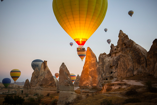 Magnificent view of hot air balloon flights in Cappadocia, Turkey September 03, 2018. Beautiful view of the balloons in Cappadocia taking off at sunrise.