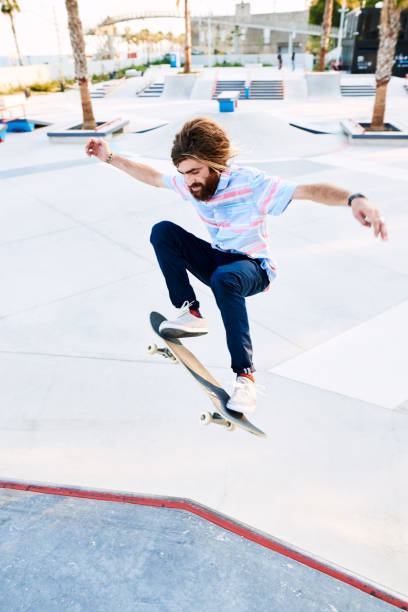 istock Bearded skater performing trick 1439034773