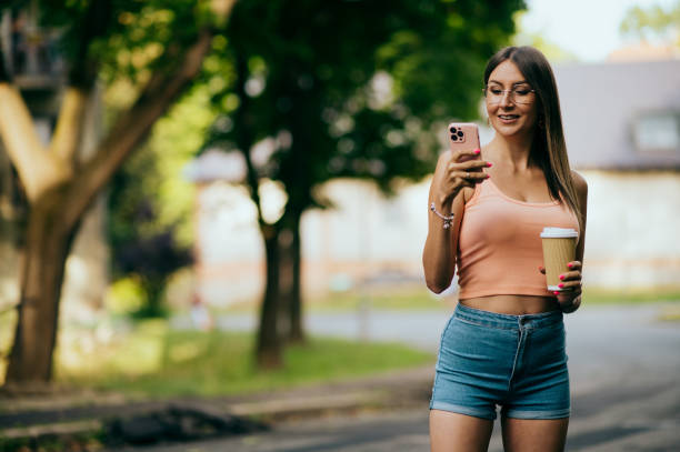 istock women using smart phone in city 1439040165