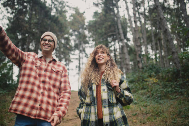 istock Two best friends enjoy walking through the forest and camping 1439053646