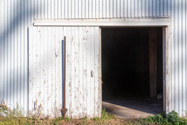 A quilt design hangs on the door of an Iowa barn.