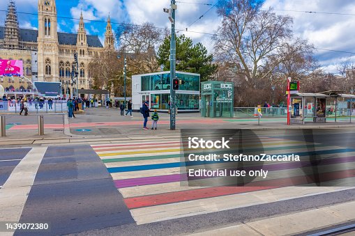 Pedestrian crossing colored with rainbow colors in front of Rathaus in Vienna, Austria