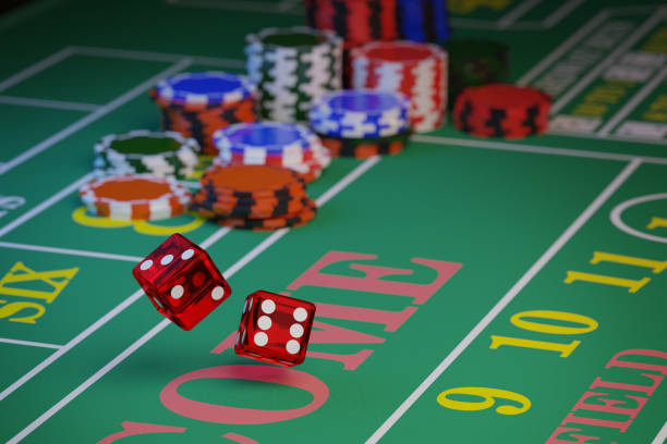 istock A pair of dice rolling down a craps table with copy space. Selective focus.Gambling concept. 3d illustration. 1439074076