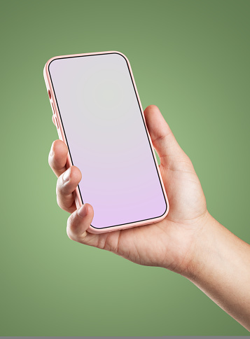 Modern smartphone in pink case with a screen template in the man's hand. Isolated on color background