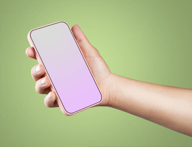 istock Modern smartphone in pink case with a screen template in the man's hand. 1439100807