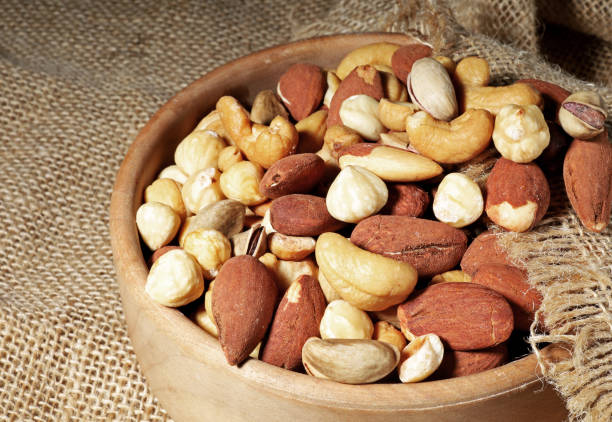 istock mixed nuts in a wooden bowl 1439111102