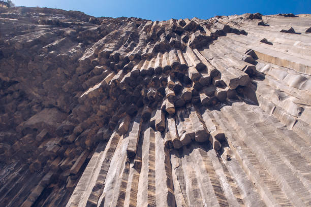 Basalt columns in Armenia. Symphony of Stones tourist attraction in Garni of rocky canyon perfect shaped geological basalt formations. stock photo