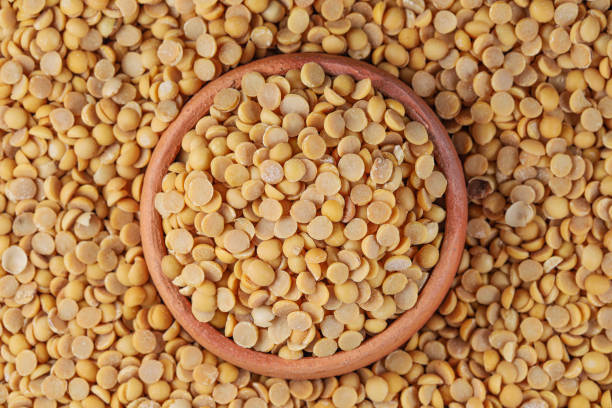 istock Peeled split soy beans (Dried Soya Beans, Food Grain). Peeled split Soybean in Pottery 1439112709