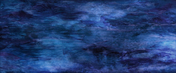 istock Watercolor blue background and texture of splashes, drops and strokes of paint. Decorative liquid fluid grunge texture for wallpaper, covers, web. Abstract marble backdrop with top view, copy space. 1439113698