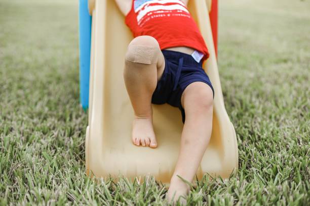 istock Barefoot child on a slide 1439118481