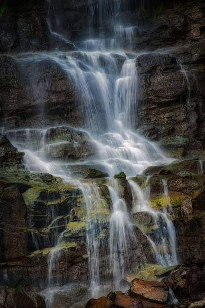 istock Scenic vertical view of a beautiful waterfall during daytime 1439118925