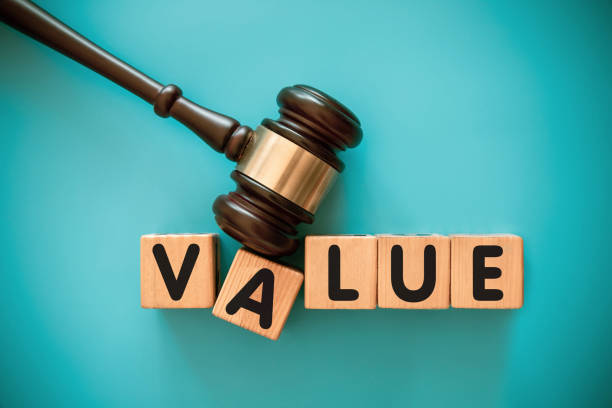 istock Gavel and wood block with VALUE 1439122815