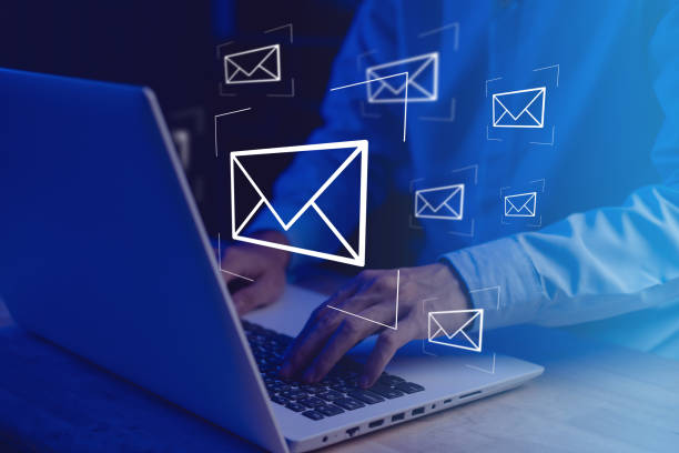 istock Businessman hands typing notebook (Laptop) with email icon and send e-mail or newsletter. Electronic mail marketing and online working internet network concept. 1439125811