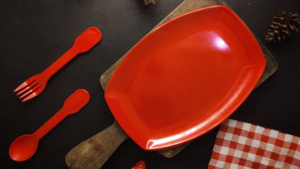 istock food template background with red empty plate. 1439125957