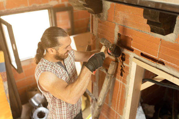istock Strong man making a groove to put wiring 1439128090