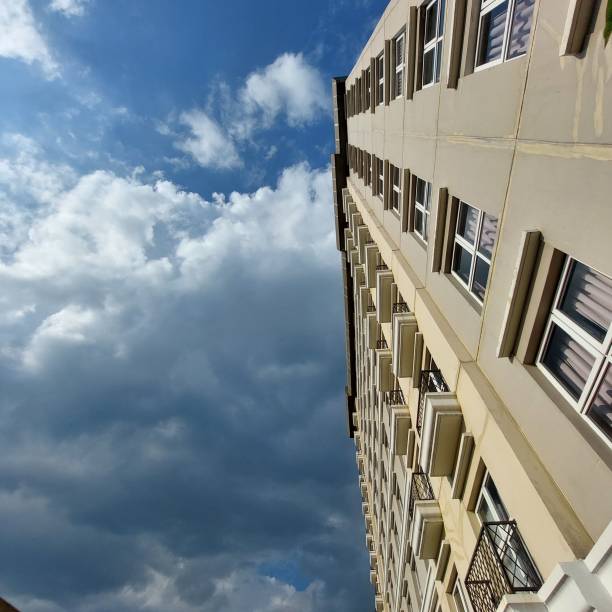 istock a building with a blue sky background, seen from below 1439130010
