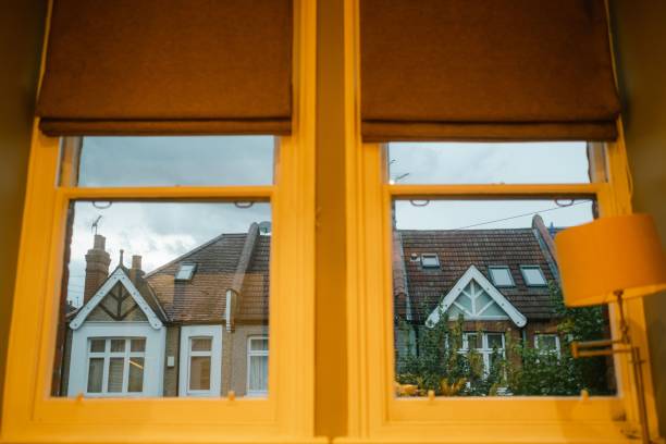 istock Neighboring house reflecting on the glass windows 1439132130