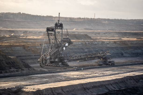 istock Wide shot of a crane and a metal structure in a mining site 1439132145