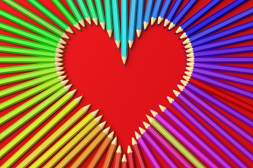 3d rendering coloured pencils in the shape of a heart, red background. Back to school