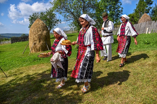 Bov, Bulgaria - April 20, 2019: Lazarki day is a Bulgarian traditional festive day. Girls who became women during the last year are called Lazarki. The girls decorate in a colorful and rich way their hairs and go around the village singing songs and dancing, in this way showing they are ready to get married.