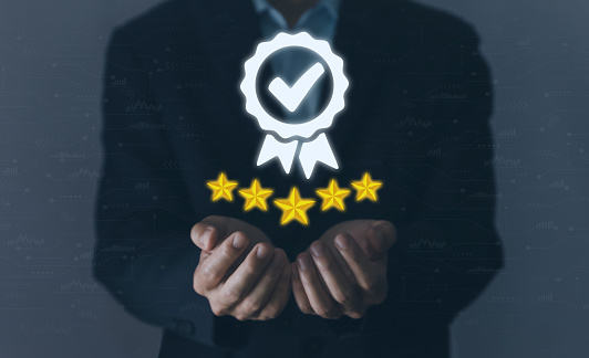 Businessman showing icon symbol checkmark digital technology. Best quality assurance service concept, product performance assurance, and industry-leading ISO certification.