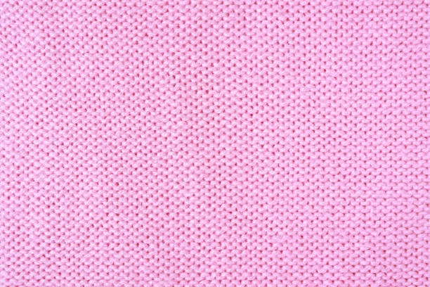 istock Bright pink knitwear wool fabric texture background. Abstract textile backdrop 1439136282