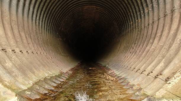 istock Stony tunnel with water 1439136407