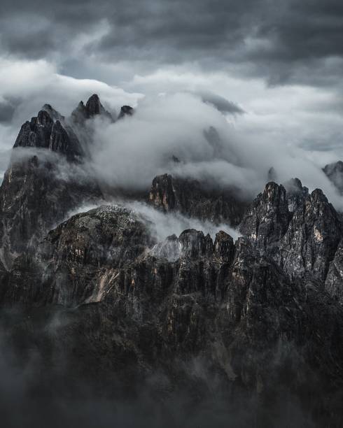 istock Aerial view of huge mountains under cloudy sky 1439136567