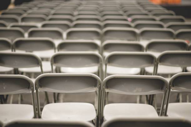 istock Gray metal chairs in a conference room before the event 1439136867