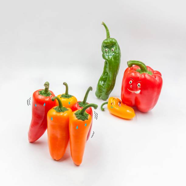 istock Funny colorful peppers isolated on white background 1439137077