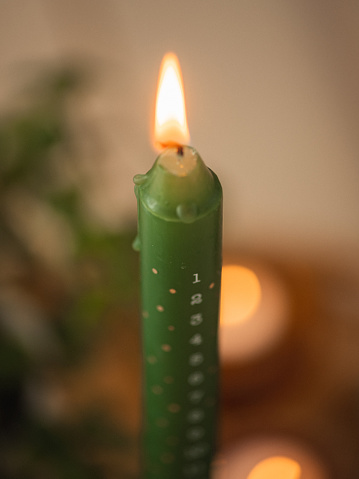 Modern christmas advent candle light \nPhoto taken indoors at  home