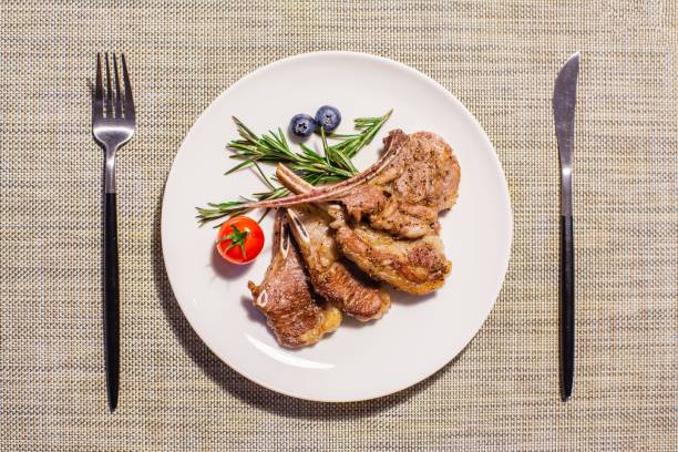 istock Overhead shot of appetizing lamb chops 1439139468