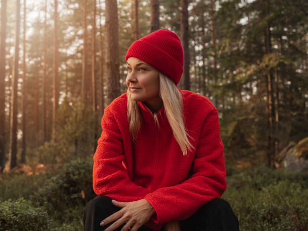 istock Woman out on hike in nature forest landscape 1439139507