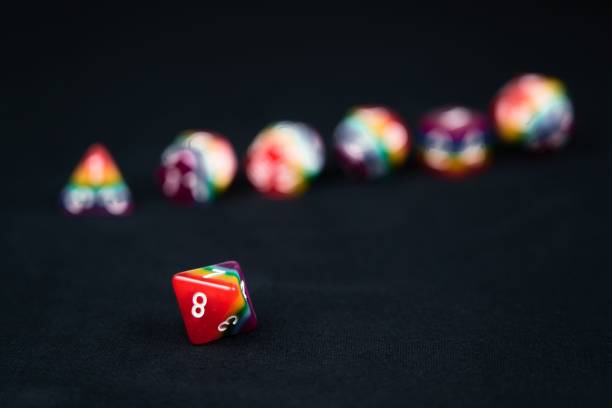 Rainbow dice Illustrating the concept of LGBTQ representation and inclusion in tabletop RPG gaming A D8 is an eight sided die used for role playing games which have recently seen an increase in representation and inclusion of diverse players developing 8 stock pictures, royalty-free photos & images