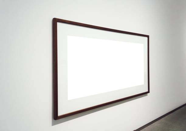 istock Square white surface with dark frames attached to a wall in a room 1439140034