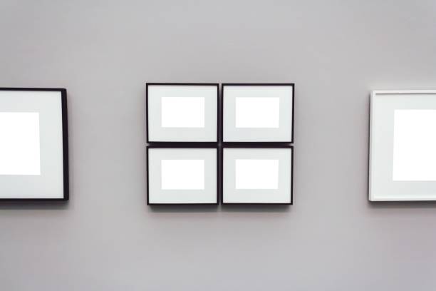 istock Square white surfaces attached to a wall in a room 1439140046