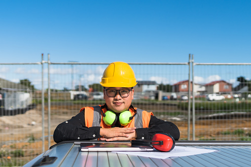 Portrait of civil engineer at construction site.