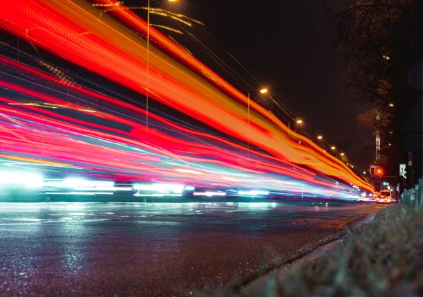 istock Red light trails in the illuminated highway at night 1439141524