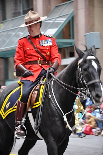 Toronto, Canada – November 15, 2009: Male RCMP officer on horseback in Santa Claus parade in Toronto, Ontario, Canada