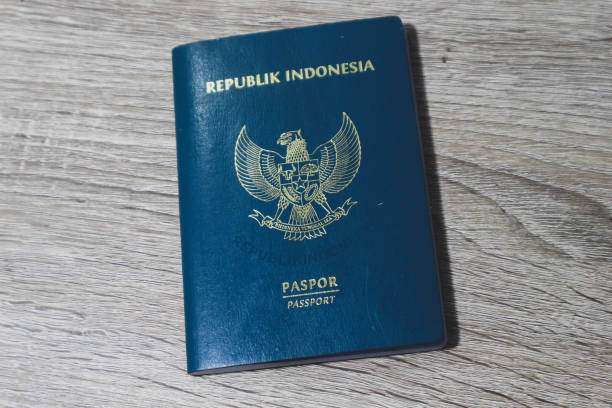 istock Indonesian green passport on a wooden table. 1439142397