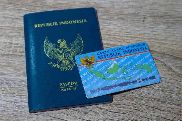 Indonesian green passport and Indonesian identity card owned by Indonesian citizens. stock photo