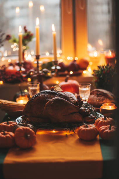 istock Thanksgiving holiday dinner table setting with fall decoration and pumpkins 1439144221
