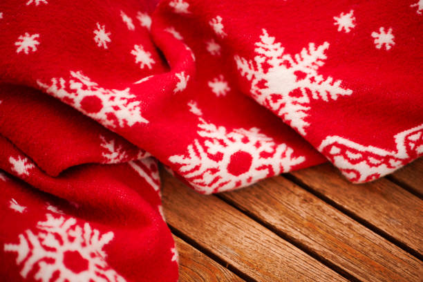 istock Cozy christmas plaid red on wooden background 1439146333